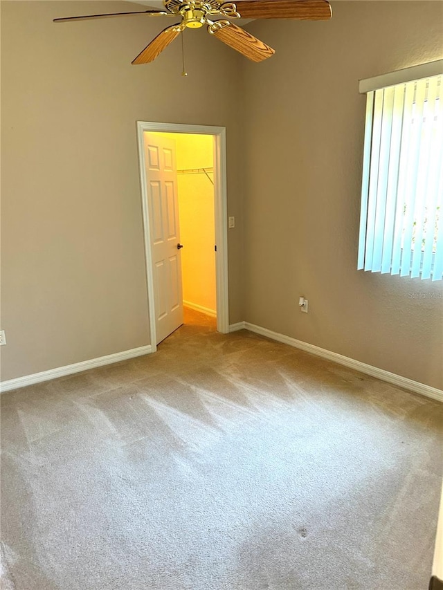 1201 Ventana Dr, Sun City Center, FL 33573 - carpeted empty room with baseboards and ceiling fan