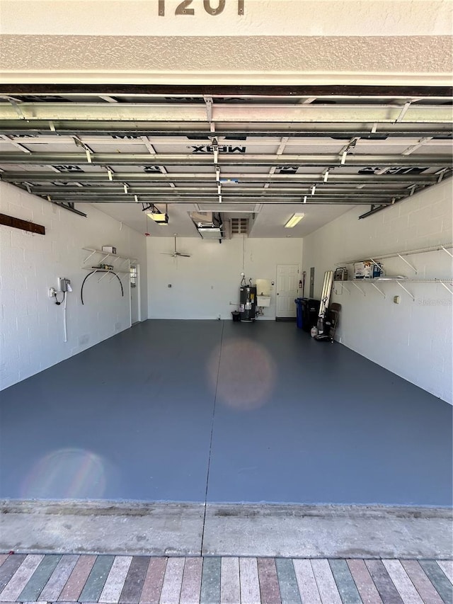 1201 Ventana Dr, Sun City Center, FL 33573 - garage with a garage door opener