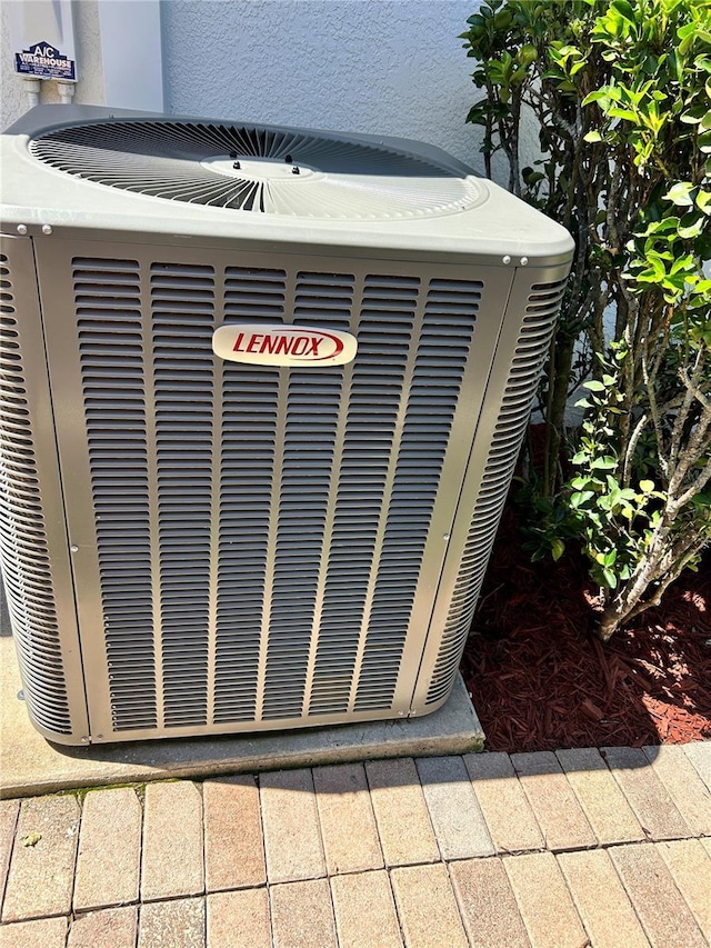 1201 Ventana Dr, Sun City Center, FL 33573 - exterior details featuring central AC unit and stucco siding