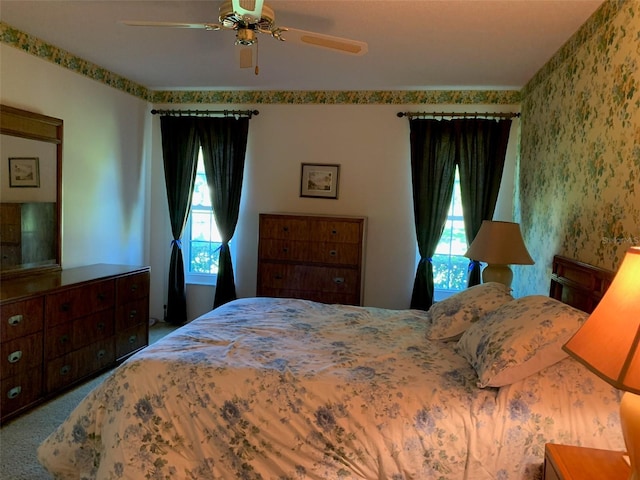 776 Lakewood Dr, Palm Harbor, FL 34684 - bedroom featuring a ceiling fan, carpet, and wallpapered walls