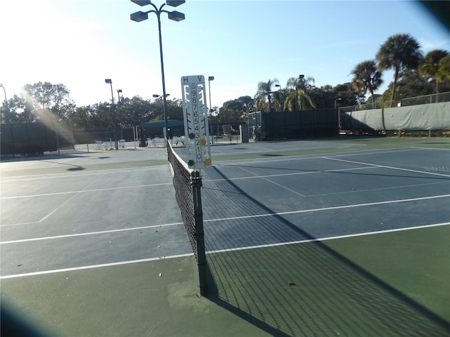 776 Lakewood Dr, Palm Harbor, FL 34684 - view of tennis court featuring fence