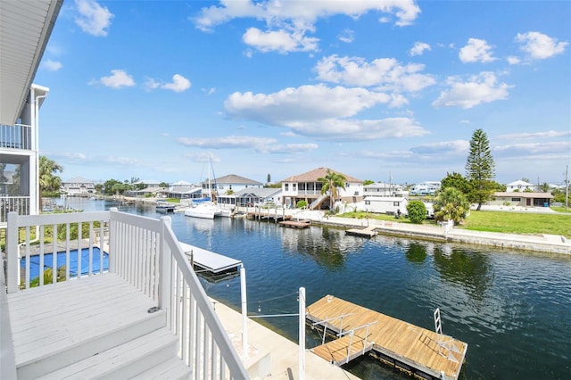 dock area featuring a water view and a residential view