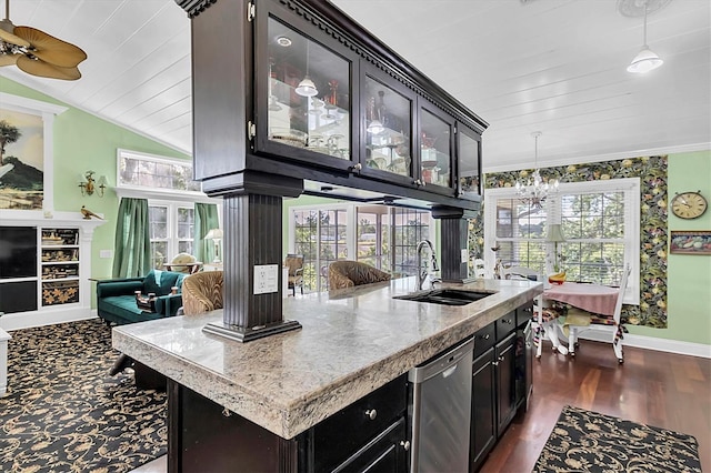 9520 Indale Dr, New Port Richey, FL 34654 - kitchen with stainless steel dishwasher, a sink, baseboards, glass insert cabinets, and open floor plan