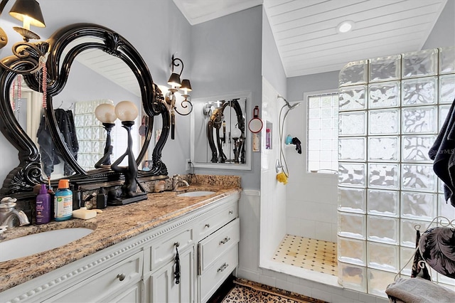 9520 Indale Dr, New Port Richey, FL 34654 - full bath with lofted ceiling, walk in shower, a sink, and double vanity