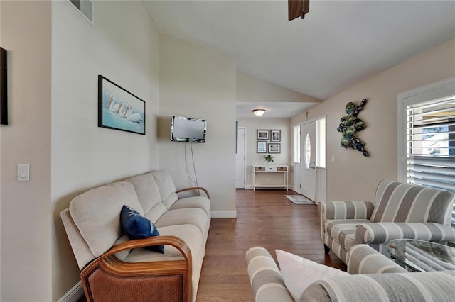 907 Golf Island Dr, Apollo Beach, FL 33572 - living area featuring lofted ceiling, hardwood / wood-style flooring, and baseboards