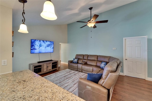 907 Golf Island Dr, Apollo Beach, FL 33572 - living room featuring wood finished floors, ceiling fan, high vaulted ceiling, and baseboards