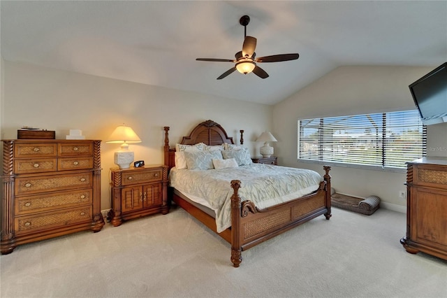 907 Golf Island Dr, Apollo Beach, FL 33572 - bedroom with light colored carpet, vaulted ceiling, ceiling fan, and baseboards