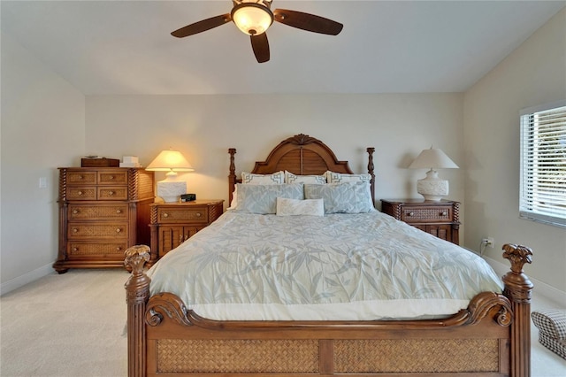 907 Golf Island Dr, Apollo Beach, FL 33572 - bedroom featuring light carpet, baseboards, vaulted ceiling, and a ceiling fan