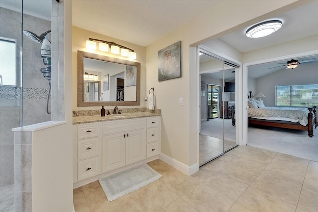 907 Golf Island Dr, Apollo Beach, FL 33572 - bathroom featuring ensuite bathroom, a walk in shower, a ceiling fan, vanity, and tile patterned floors