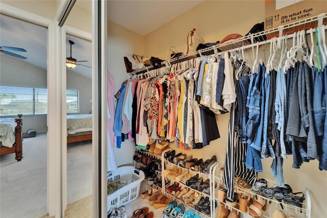 907 Golf Island Dr, Apollo Beach, FL 33572 - spacious closet with a ceiling fan, vaulted ceiling, and carpet floors