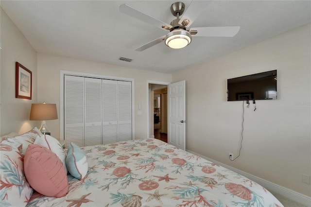 907 Golf Island Dr, Apollo Beach, FL 33572 - carpeted bedroom with a closet, ceiling fan, and baseboards