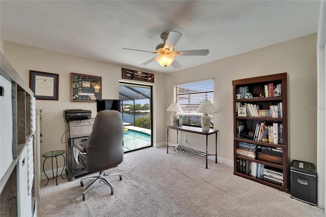 907 Golf Island Dr, Apollo Beach, FL 33572 - carpeted office space featuring a ceiling fan, a textured ceiling, and baseboards