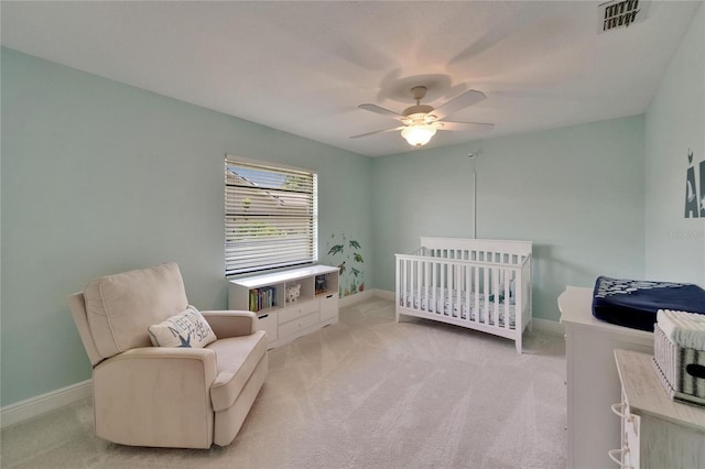907 Golf Island Dr, Apollo Beach, FL 33572 - carpeted bedroom with ceiling fan, a crib, and baseboards