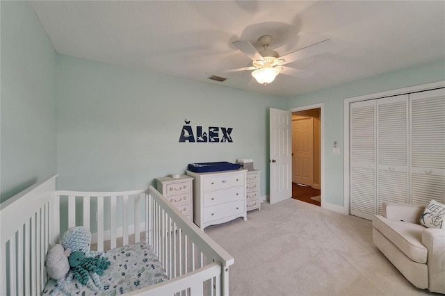 907 Golf Island Dr, Apollo Beach, FL 33572 - carpeted bedroom featuring a closet, a ceiling fan, baseboards, and a crib