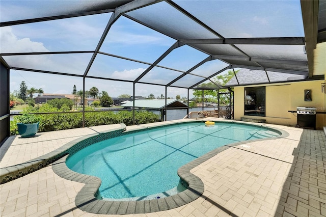 907 Golf Island Dr, Apollo Beach, FL 33572 - outdoor pool featuring a patio, grilling area, and glass enclosure