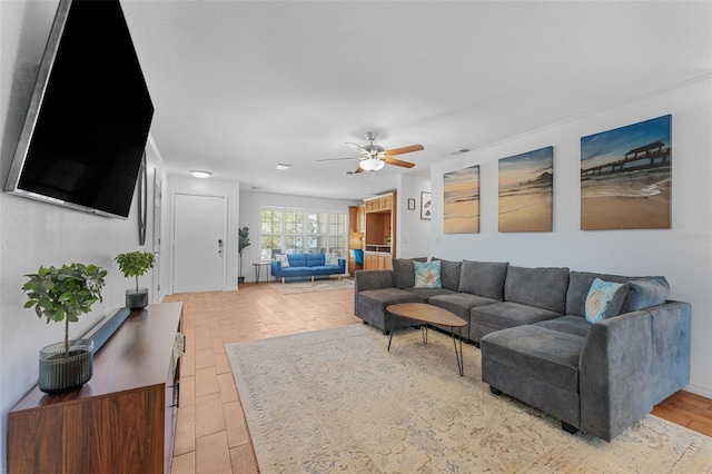 living room featuring ceiling fan