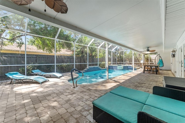 view of pool featuring ceiling fan, a fenced backyard, a patio, and a lanai