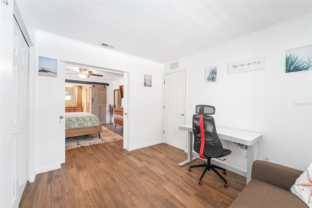 office area featuring wood finished floors and baseboards