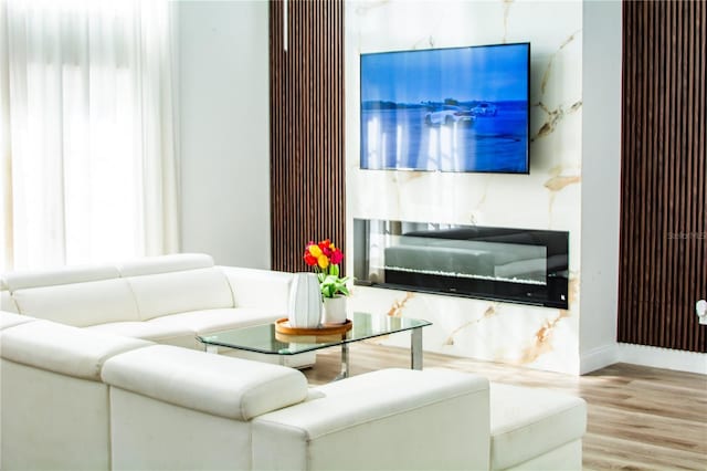 living room featuring baseboards and wood finished floors