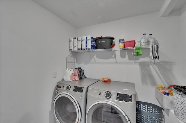 washroom with washer and dryer and laundry area