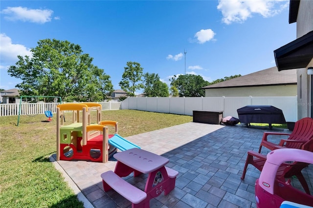 view of patio / terrace with a fenced backyard and a playground