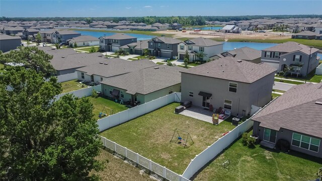bird's eye view with a water view and a residential view