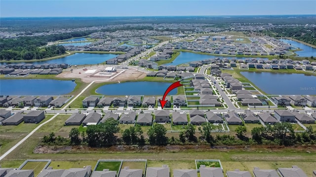 aerial view featuring a water view and a residential view