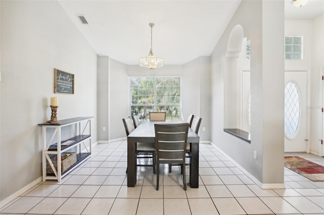 dining room featuring visible vents, baseboards, a notable chandelier, and light tile patterned floors