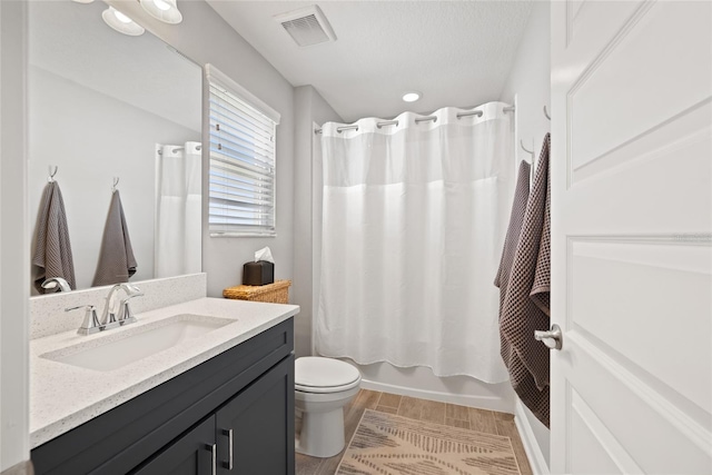 4108 Mellon Dr, Odessa, FL 33556 - full bathroom featuring vanity, shower / bath combo, recessed lighting, toilet, and visible vents