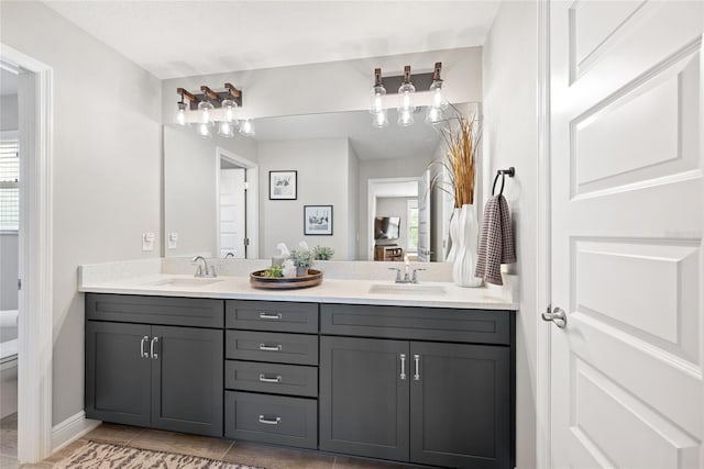 4108 Mellon Dr, Odessa, FL 33556 - full bathroom featuring toilet, double vanity, a sink, and baseboards