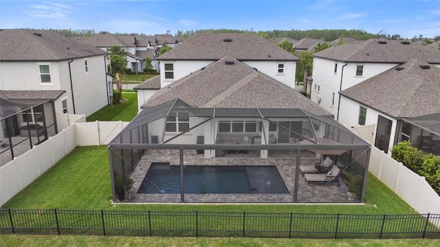 4108 Mellon Dr, Odessa, FL 33556 - back of house with a yard, a fenced backyard, glass enclosure, and a residential view