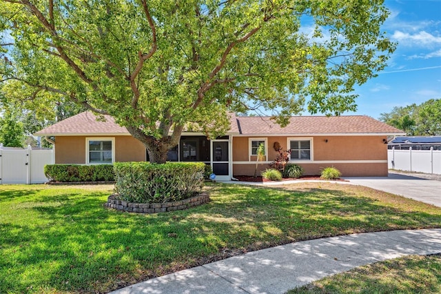 506 Spring Tree Ct, Tarpon Springs, FL 34689 - single story home with stucco siding and a gate