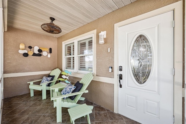 506 Spring Tree Ct, Tarpon Springs, FL 34689 - doorway to property featuring stucco siding