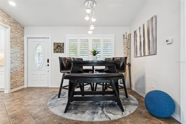 506 Spring Tree Ct, Tarpon Springs, FL 34689 - dining space featuring plenty of natural light and baseboards