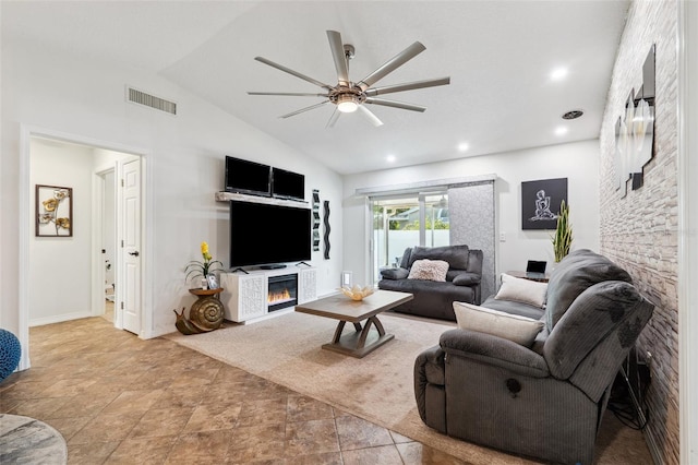 506 Spring Tree Ct, Tarpon Springs, FL 34689 - living area featuring a glass covered fireplace, a ceiling fan, lofted ceiling, and baseboards