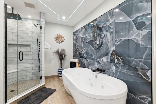506 Spring Tree Ct, Tarpon Springs, FL 34689 - bathroom featuring a soaking tub, a stall shower, recessed lighting, marble finish floors, and baseboards