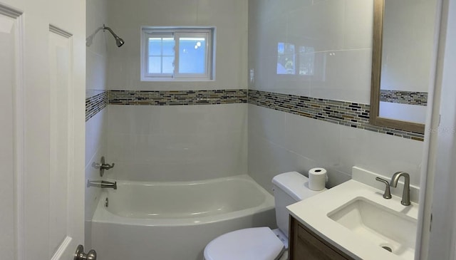 4301 15th Ave N, Saint Petersburg, FL 33713 - full bathroom with tile walls, vanity, toilet, and bathing tub / shower combination