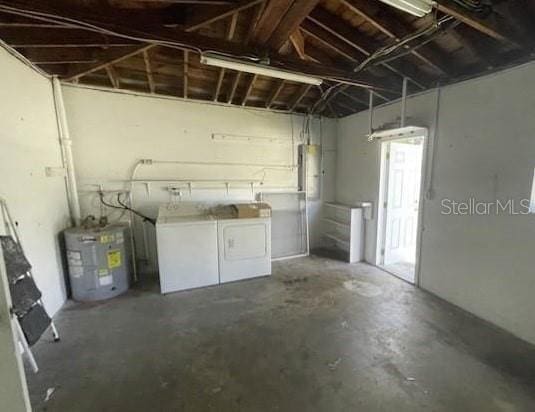 4301 15th Ave N, Saint Petersburg, FL 33713 - basement featuring washer and dryer, a garage, and water heater