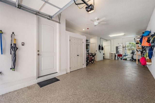409 Regent Ln N, Saint Petersburg, FL 33701 - garage featuring a ceiling fan and a garage door opener