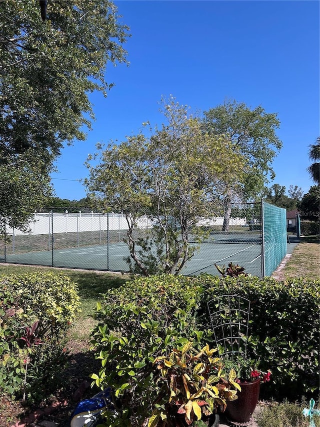 view of tennis court with fence