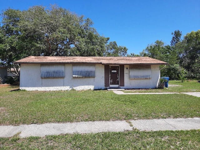 9355 Pinero St, Spring Hill, FL 34608 - single story home featuring a front yard and stucco siding