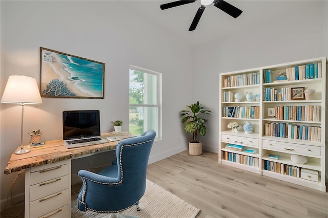 home office with ceiling fan, light wood-type flooring, and baseboards