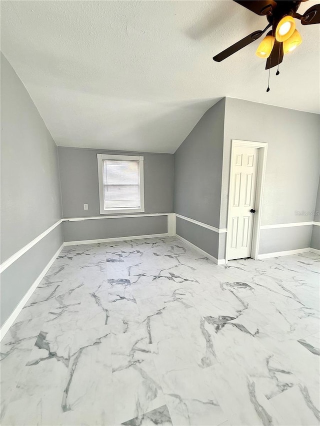 1318 W Broad St, Tampa, FL 33604 - additional living space with baseboards, ceiling fan, a textured ceiling, and marble finish floor