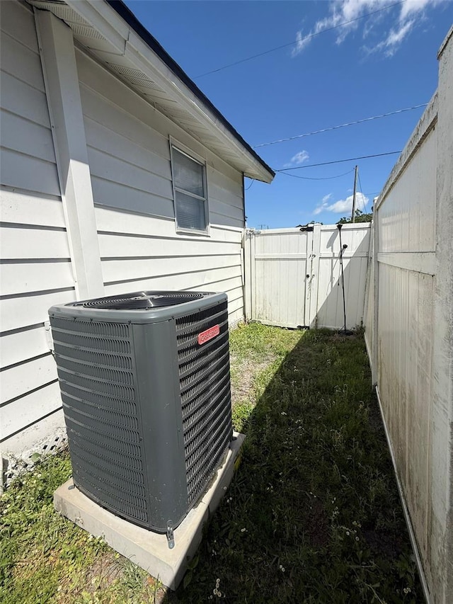 1318 W Broad St, Tampa, FL 33604 - view of yard with central air condition unit, a gate, and fence