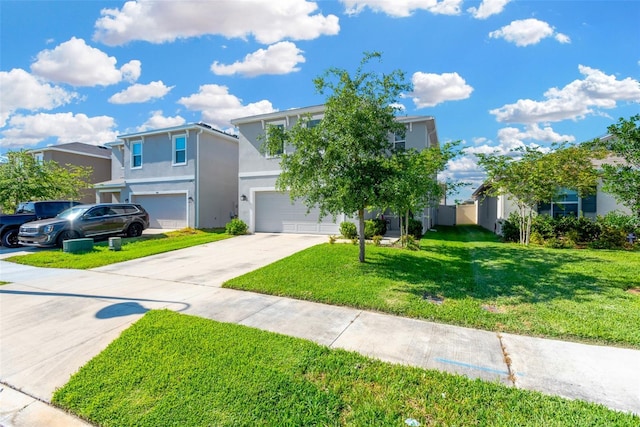 view of front of home featuring concrete driveway, a front lawn, a garage, and stucco siding