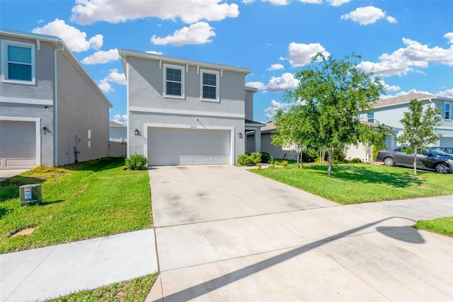 view of front of home with a front yard, stucco siding, a garage, and concrete driveway
