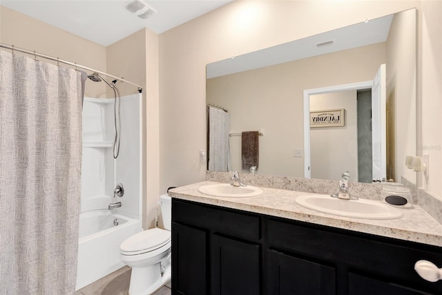 full bathroom with double vanity, a sink, toilet, and shower / bath combo with shower curtain