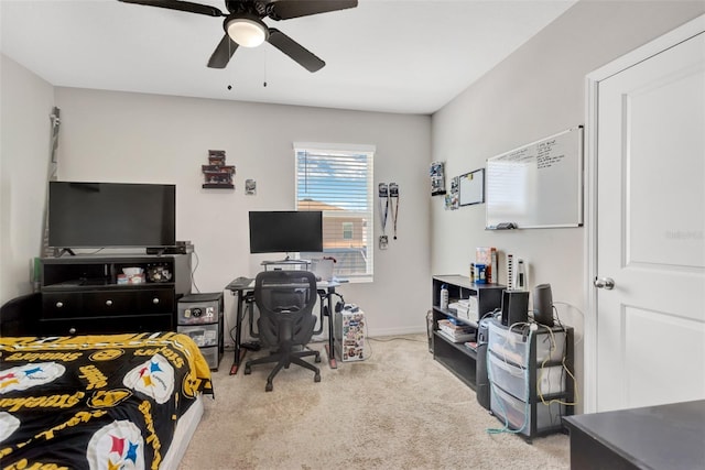 carpeted bedroom featuring baseboards and ceiling fan