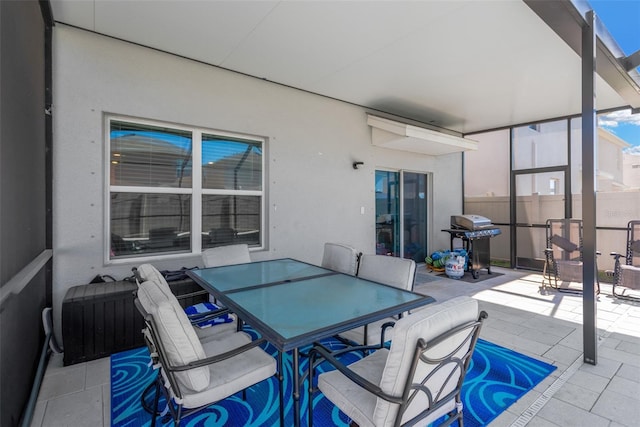 view of patio / terrace featuring fence, outdoor dining area, and area for grilling