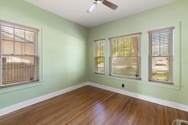 1905 Mckinley St, Clearwater, FL 33765 - unfurnished room with baseboards, a ceiling fan, and wood finished floors